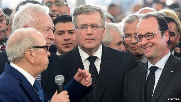 Spain's Foreign Minister Jose Manuel Garcia-Margallo (L), Poland's President Bronislaw Komorowski (C) and France's President Francois Hollande (R) listen to a speech by Tunisia's President Beji Caid Essebsi (front left) in Tunis, 29 March 2015