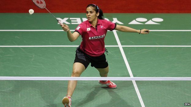 India"s Saina Nehwal returns a shot against Thailand"s Ratchanok Intanon (unseen) in the Women"s Single final match of Yonex India Open Superseries 2015 held in New Delhi, India on 29 March 2015.