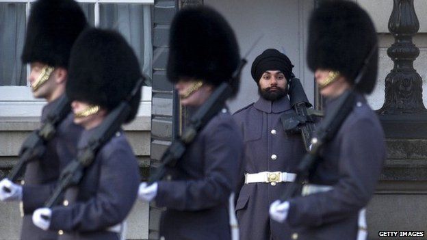 A solider on guard duty wearing a turban