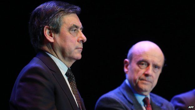 Former French prime ministers and UMP right-wing opposition party politicians Francois Fillon (L) and Alain Juppe (March 2015)