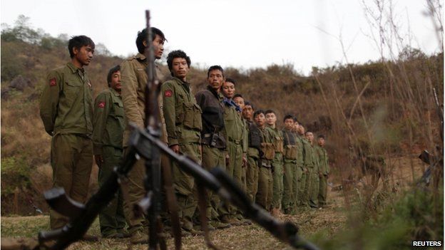 Rebel soldiers of Myanmar National Democratic Alliance Army (MNDAA) gather at a military base in Kokang region, 11 March 2015