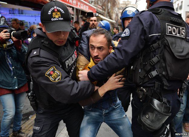 Turkish police arrest a protester in Ankara - file pic