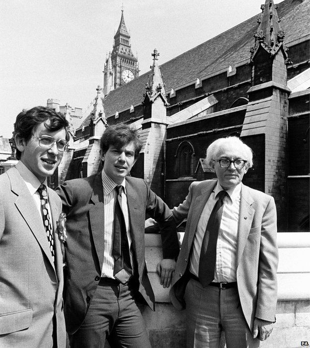 Labour Leader Michael Foot outside the Houses of Parliament with Anthony Blair (centre) and David Nicholas, 1982