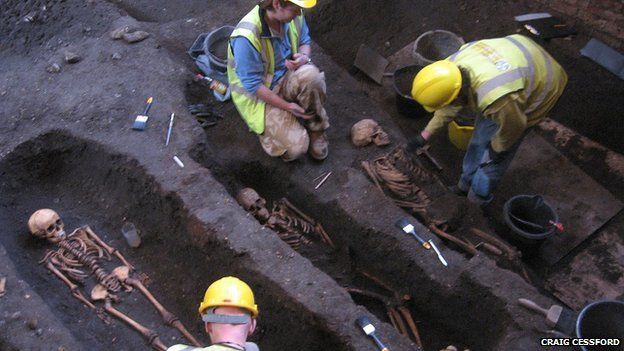 Archaeologists uncovering bodies at St John's College