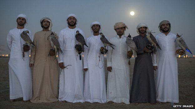 Emirati men with their falcons