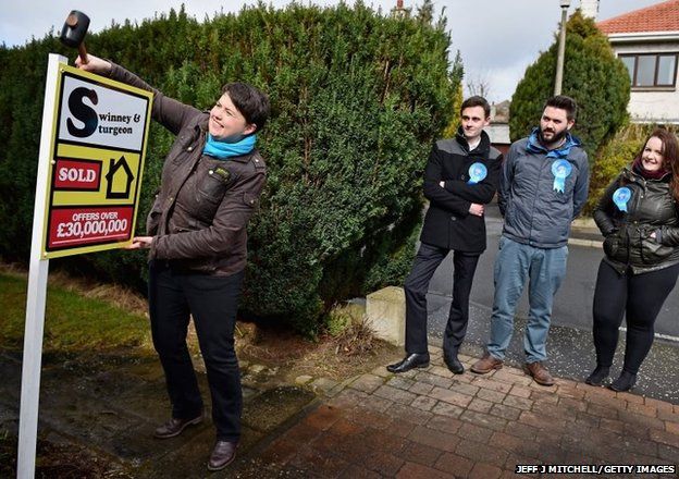 Scottish Conservative leader Ruth Davidson erects a mock for sale sign