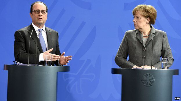French president Francois Hollande and German chancellor Angela Merkel attend a joint press conference on March 31, 2015 at the chancellery in Berlin