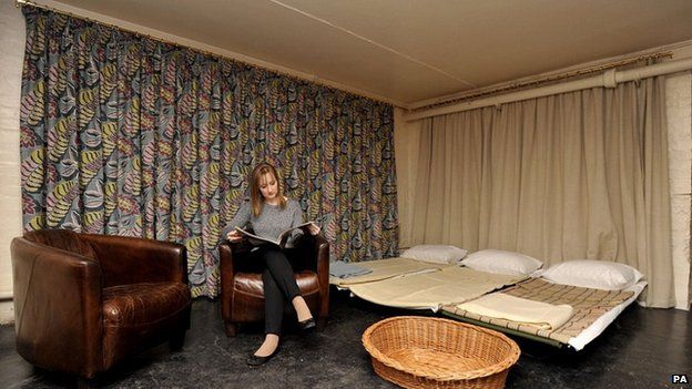 A model reads in the bunker in Eltham Palace