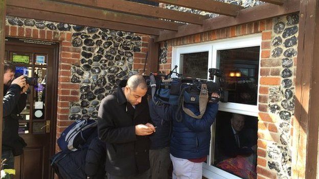 Camera crews press up against pub windows for shot of Farage inside