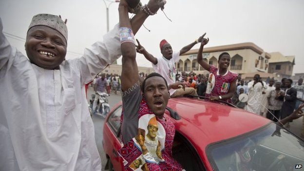 Supporters of opposition candidate Muhammadu Buhari celebrate an anticipated win for their candidate, in Kano, Nigeria on 31 March 2015.