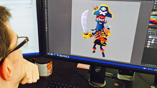 Midoki employee works on screenshot of Plunder Pirates