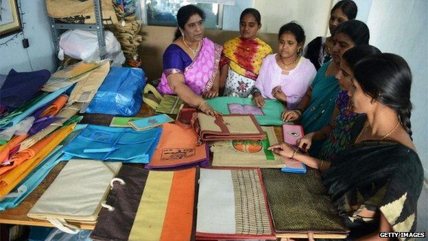 Women learn how to make bags during a workshop in Hyderabad