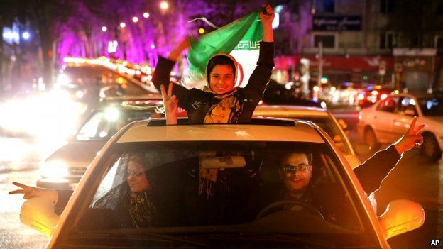 Iranians celebrate on a street in northern Tehran, Iran, Thursday, April 2, 2015