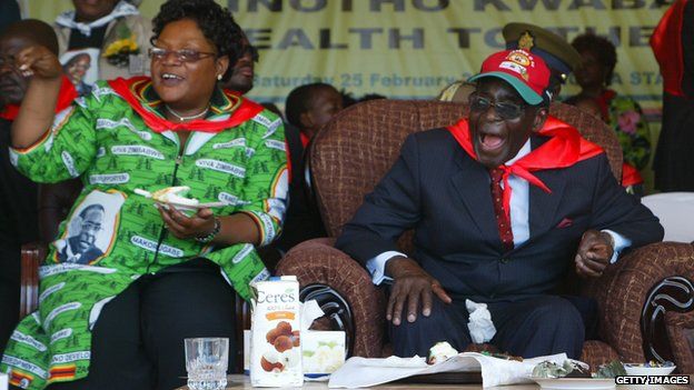 Zimbabwe's President Robert Mugabe (R) and Vice-President Joice Mujuru (L) in 2012