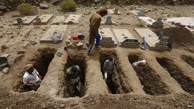 Locals dig graves for the victims of an airstrike allegedly carried out by the Saudi-led coalition targeting Houthi rebels' positions in the village of Hajer Akash, Sanaa, Yemen, 04 April 2015
