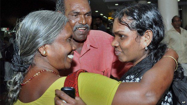 Indian nurse evacuated from Yemen, right, is welcomed by her parents upon arrival in Kochi, India