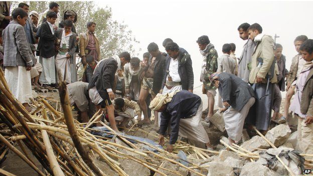 Yemenis search for survivors in the rubble of houses destroyed by Saudi-led airstrikes in a village near Sanaa, Yemen on 4 April 4, 2015.