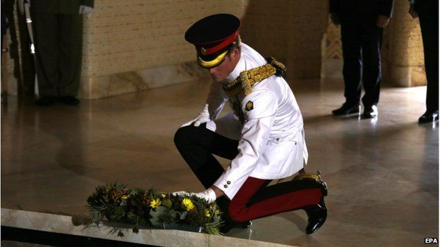 Prince Harry laying a wreath