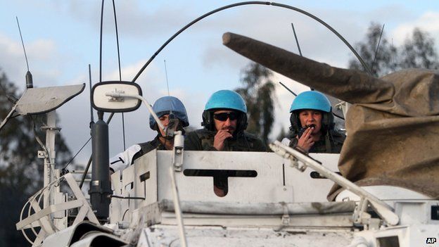 Spanish UN peacekeepers in an armoured vehicle patrol the Lebanese-Israeli border, in the southern village of Abbasiyeh, Lebanon (28 Jan 2015)