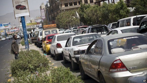 Cars line up in a queue at a petrol station amid fuel shortages in Sanaa, Yemen, Wednesday, April 8, 2015.