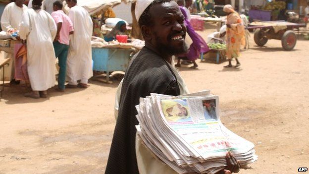 A Sudanese man sells newspapers at a market in Shendi, the hometown of Sudanese President Omar al-Bashir