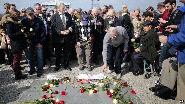 Crowds lay down flowers at Buchenwald on 11 April 2015