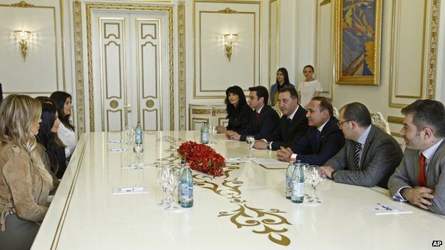 Kim Kardashian, second left, and Khloe Kardashian, left, meet Armenian Prime Minister Hovik Abrahamyan, third right