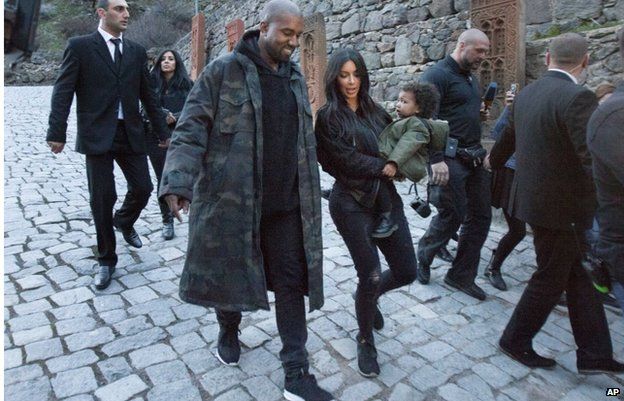 Kanye West with Kim Kardashian and daughter