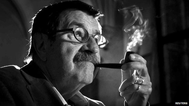 German novelist and winner of the Nobel Prize in Literature Guenter Grass smokes his pipe during a meeting in Gdansk in this September 11, 2005 file picture.