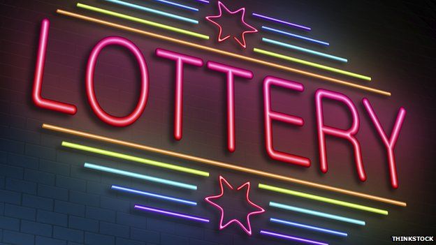 Lottery sign lights up in neon