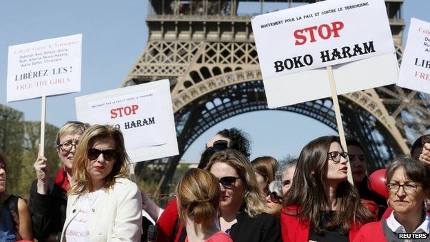 Former French first lady Valerie Trierweiler (L) attends a "Bring Back Our Girls" gathering near the Eiffel Tower in Paris, 14 April 2015