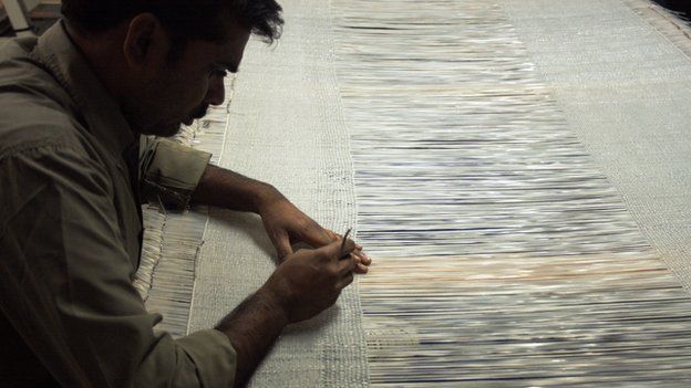 The entire sari has been hand woven