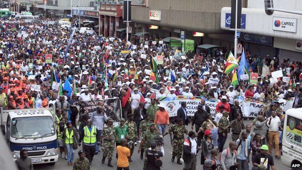 Thousands of people take part in the "peace march" against xenophobia in Durban, South Africa, on 16 April 2015