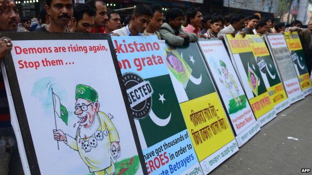 Bangladesh Awami League supporters protest with anti-Pakistan placards in Dhaka on December 23, 2013