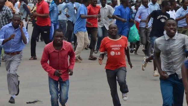 protesters running away from police during protests in Bujumbura