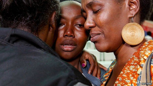 People react after meeting their relative who was rescued from the Garissa University
