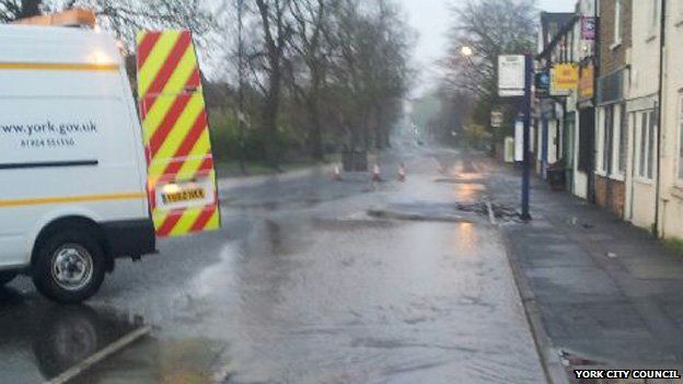 Water main burst causes York road closure - BBC News