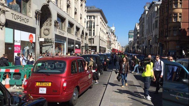 London gridlocked in taxi protest over illegal touting - BBC News