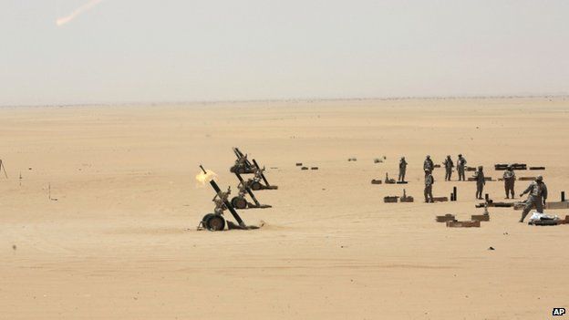 Saudi soldiers fire artillery towards the border with Yemen in Najran, Saudi Arabia, 21 April