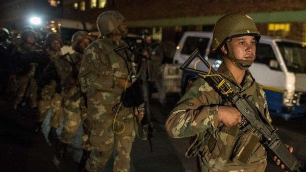 South Africa army raids to curb xenophobic attacks - BBC News