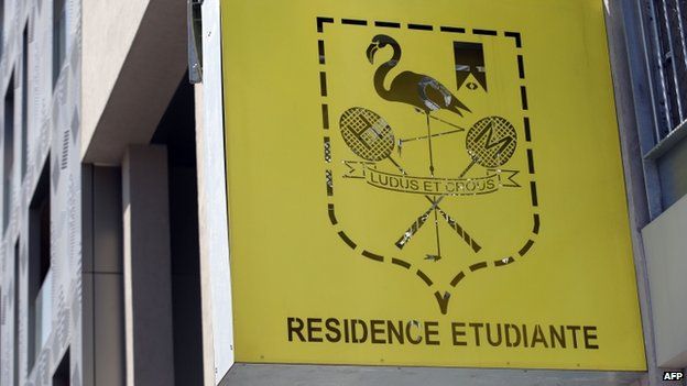 A picture taken on April 22, 2015 shows the logo of the student residence where an It student, suspected of planning a church attack in France, lived in Paris