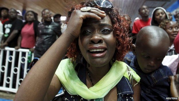 A woman reacts after seeing her sister who was rescued from the Garissa University attack in Kenya's capital Nairobi 4 April 2015