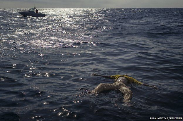 The body of a drowned migrant floats in the sea near the coast of Fuerteventura, one of Spain's Canary Islands January 18, 2004.