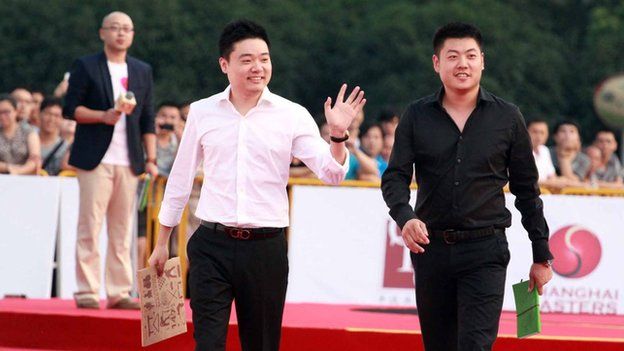 Ding Junhui (left) and Liang Wenbo on the red carpet before the Shanghai Masters