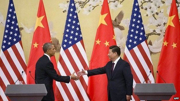 US President Barack Obama and Chinese President Xi Jinping shake hands
