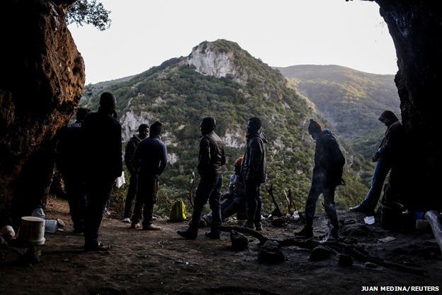 African migrants stand at their hiding place in the mountains - 2014