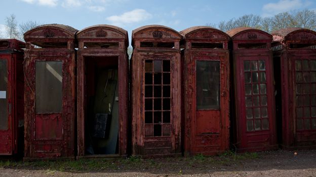 Row of derelict phone boxes