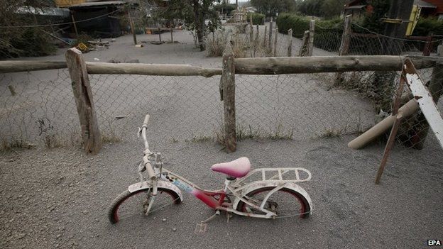 General view of child's bicycle covered in ash at the Ensenada locality, outskirts of Calbuco volcano, which erupted on 22 April after 40 years without activity