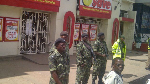 police guard South African shops in Blantyre were under heavy security on Friday