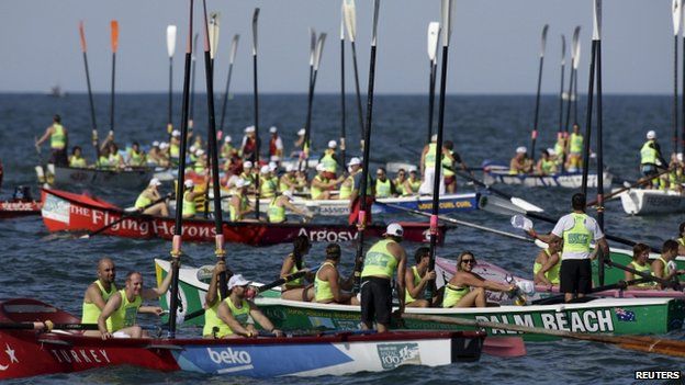 In Sydney dozens of surf boats from Australia, New Zealand and Turkey raise their oars in tribute